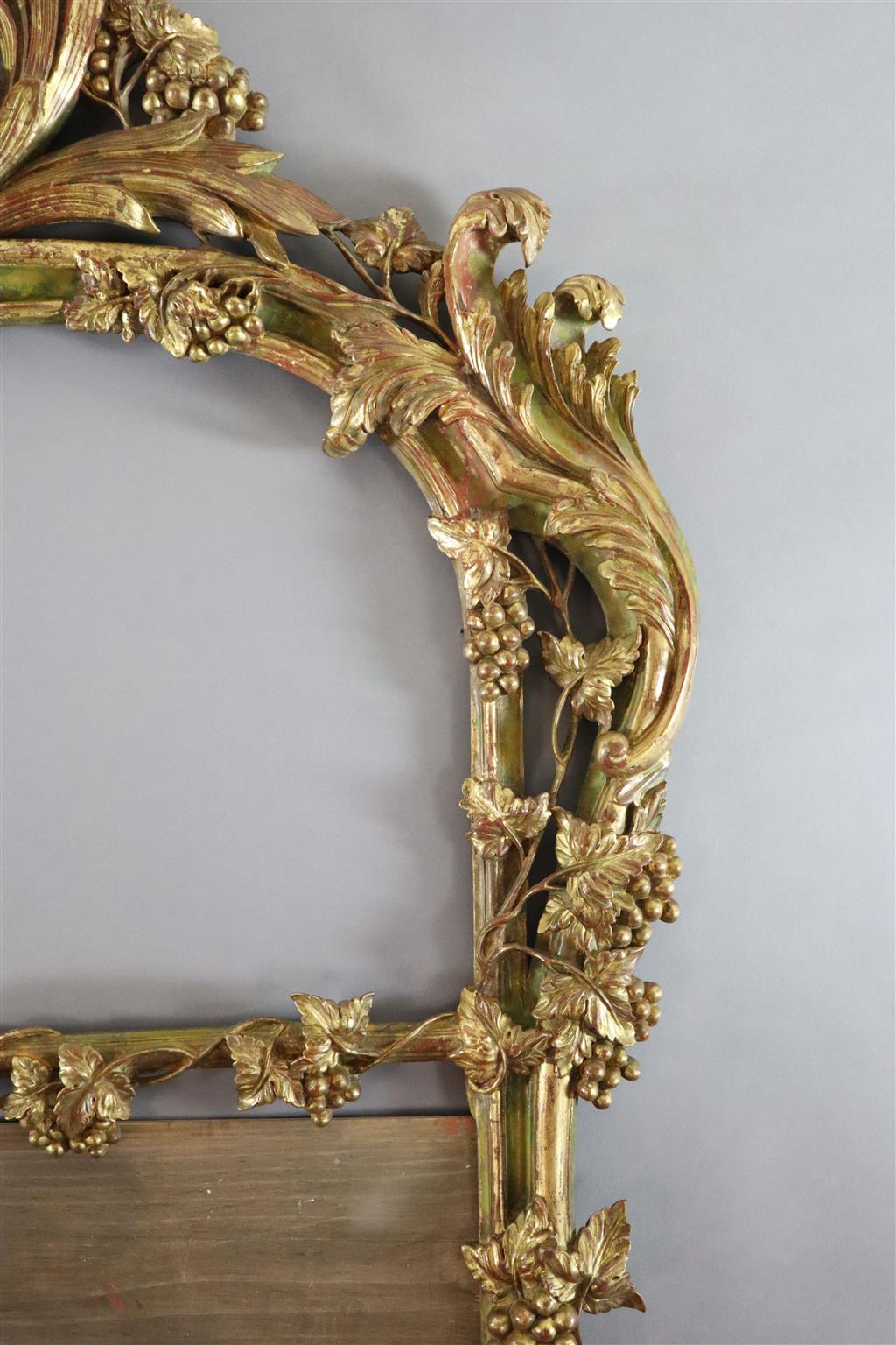 A 19th century giltwood overmantel mirror frame, width 4ft 1in. height 7ft 8in.